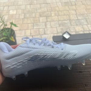 White brand new under armor cleats size 12